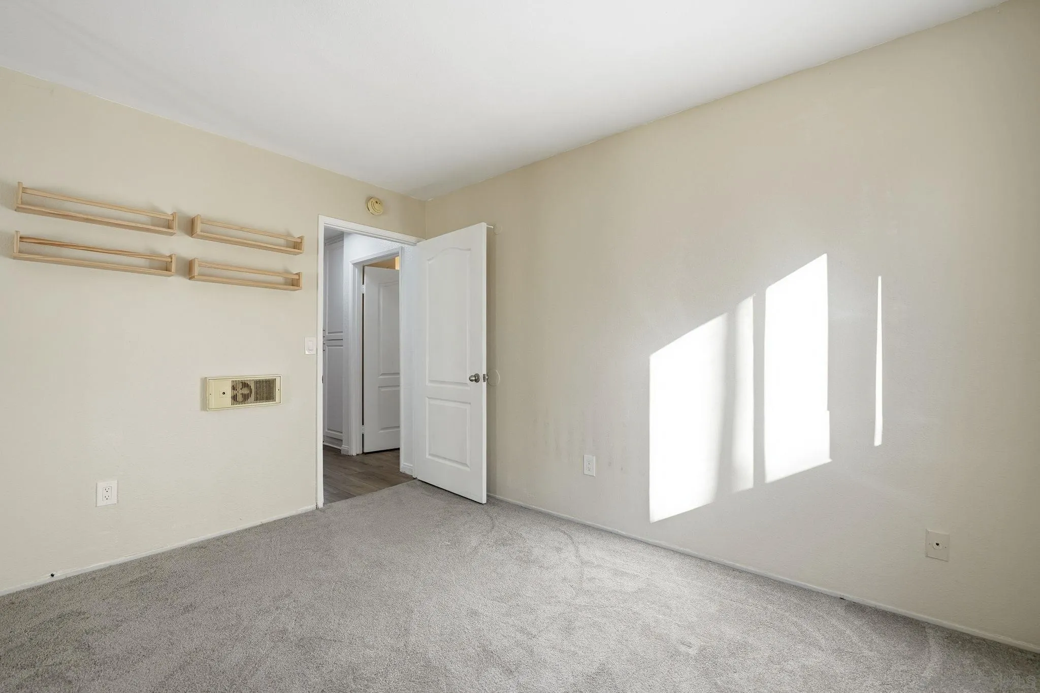 3557 Kenora Drive, Unit 31 Spring Valley, CA 91977 - Photo 11 of 24 a view of an empty room with a window