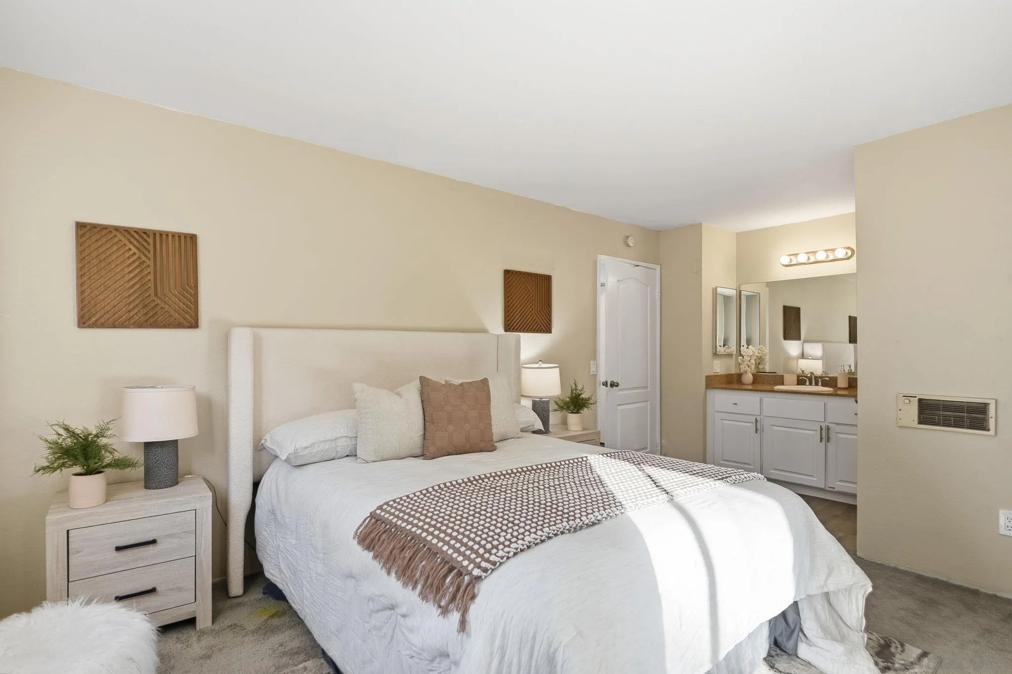 3557 Kenora Drive, Unit 31 Spring Valley, CA 91977 - Photo 13 of 24 a bedroom with a bed and a view of bathroom