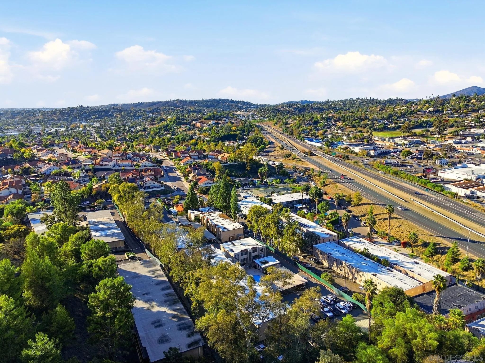 3557 Kenora Drive, Unit 31 Spring Valley, CA 91977 - Photo 22 of 24 an aerial view of a city with lots of residential buildings