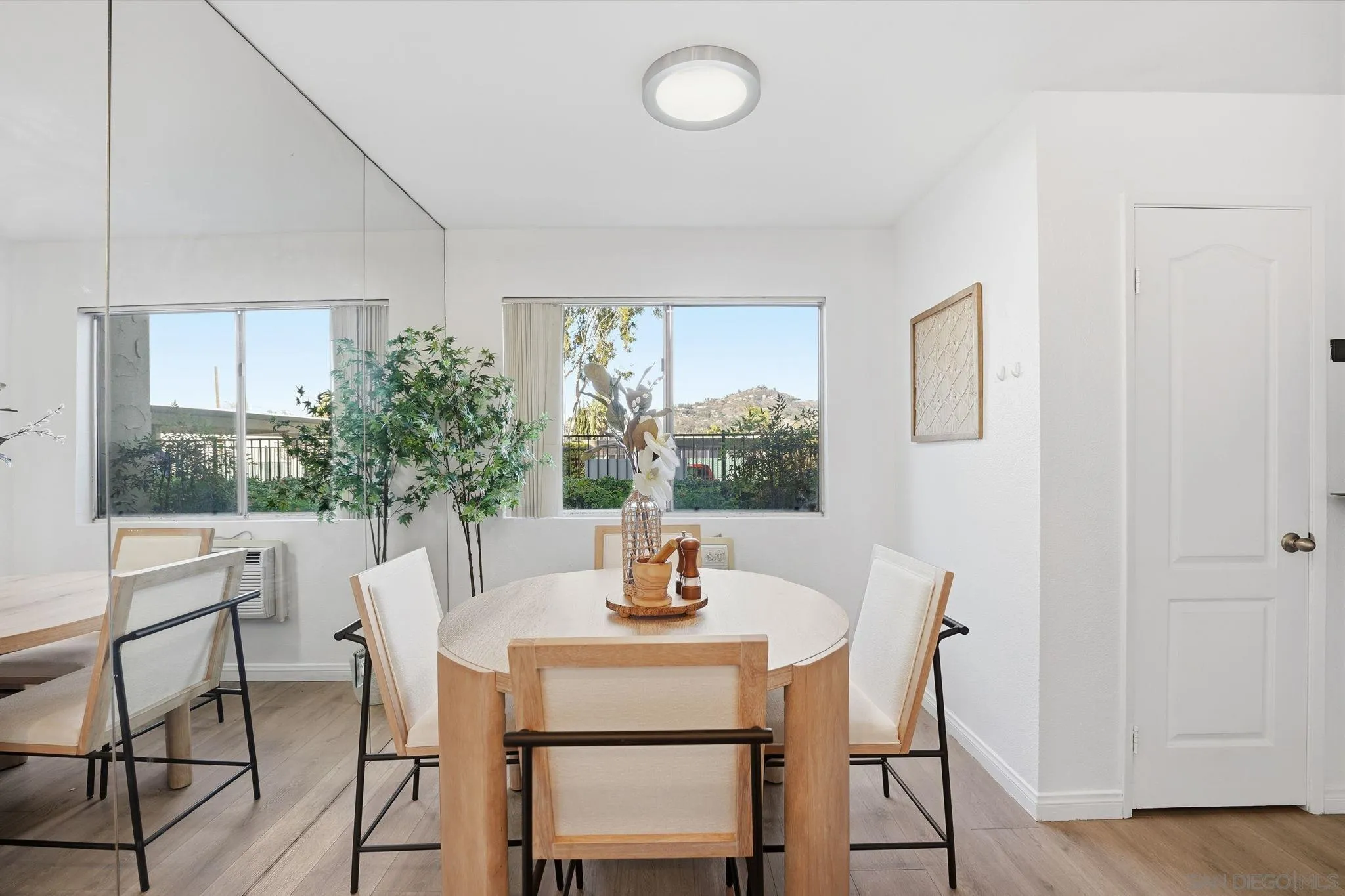 3557 Kenora Drive, Unit 31 Spring Valley, CA 91977 - Photo 3 of 24 a view of a dining room with furniture window and wooden floor