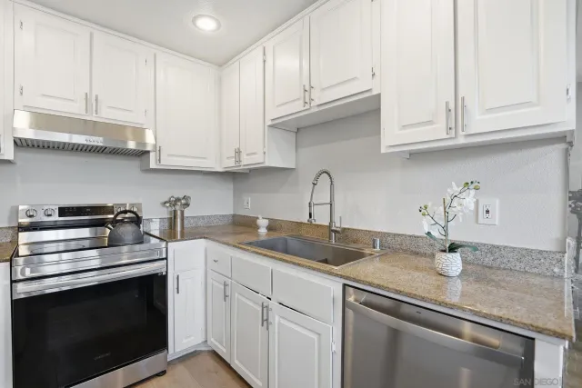 a kitchen with appliances cabinets and a counter top