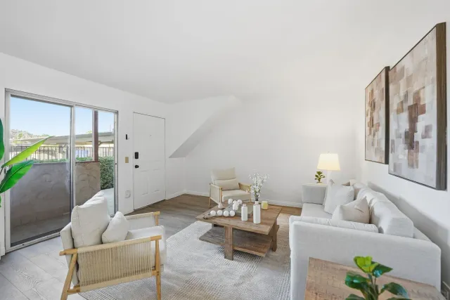 a living room with furniture and a table