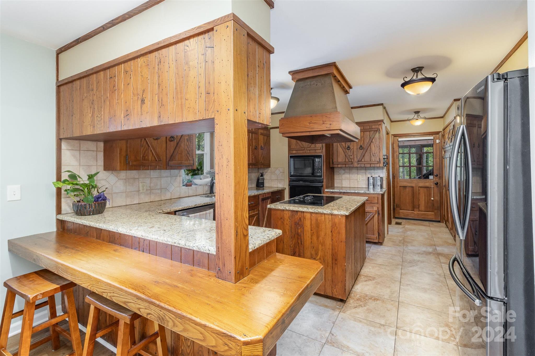 808 Dogwood Drive Lowell, NC 28098 - Photo 11 of 36 a kitchen with stainless steel appliances granite countertop a refrigerator and a sink