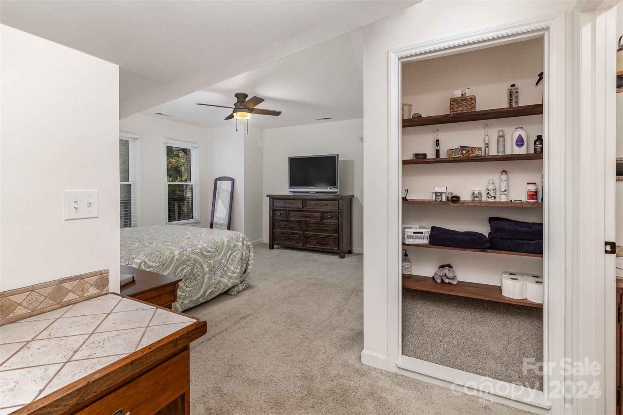 808 Dogwood Drive Lowell, NC 28098 - Photo 16 of 36 a bedroom with a bed and a television