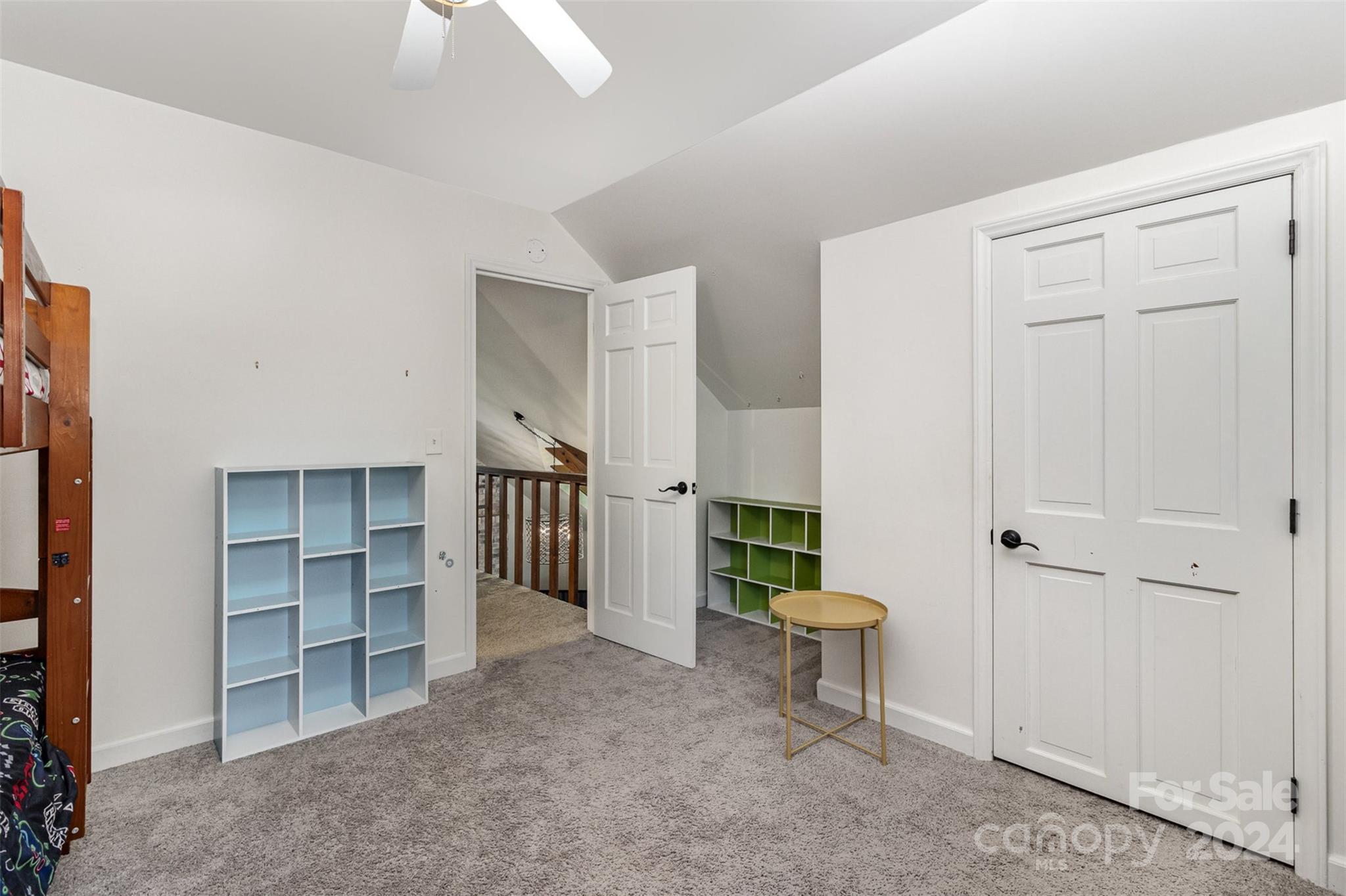 808 Dogwood Drive Lowell, NC 28098 - Photo 20 of 36 a view of a room with a furniture and a ceiling fan