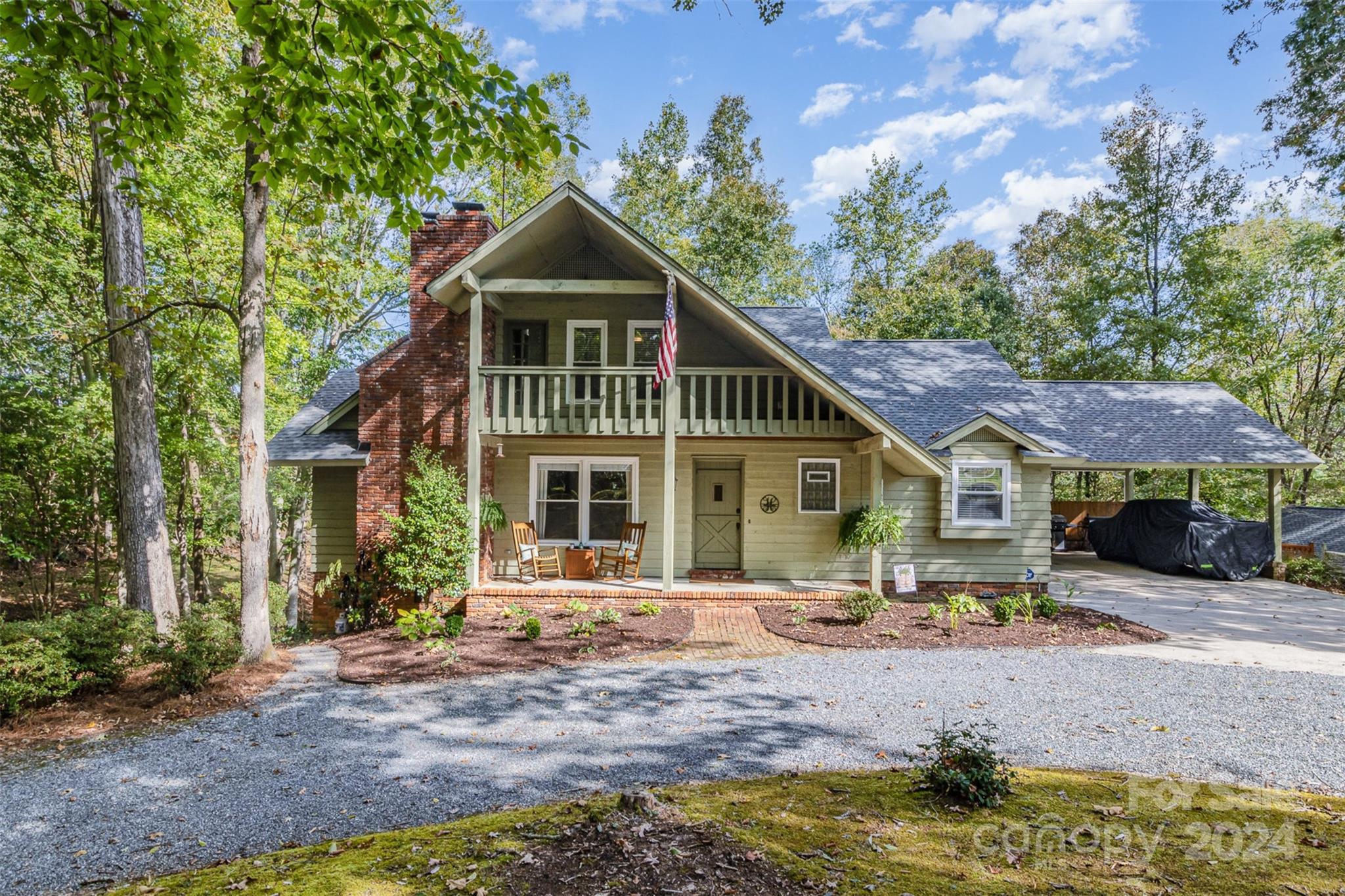808 Dogwood Drive Lowell, NC 28098 - Photo 2 of 36 a front view of a house with garden