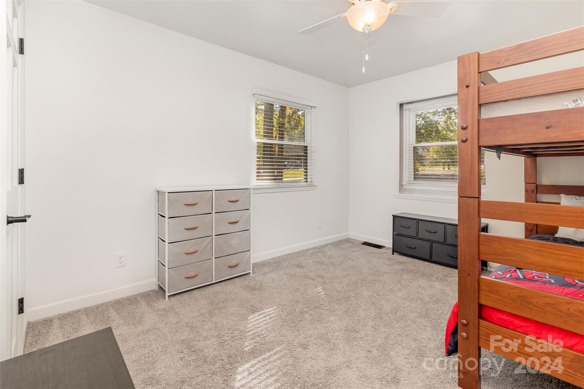 808 Dogwood Drive Lowell, NC 28098 - Photo 22 of 36 wooden floor and an empty room with a dresser