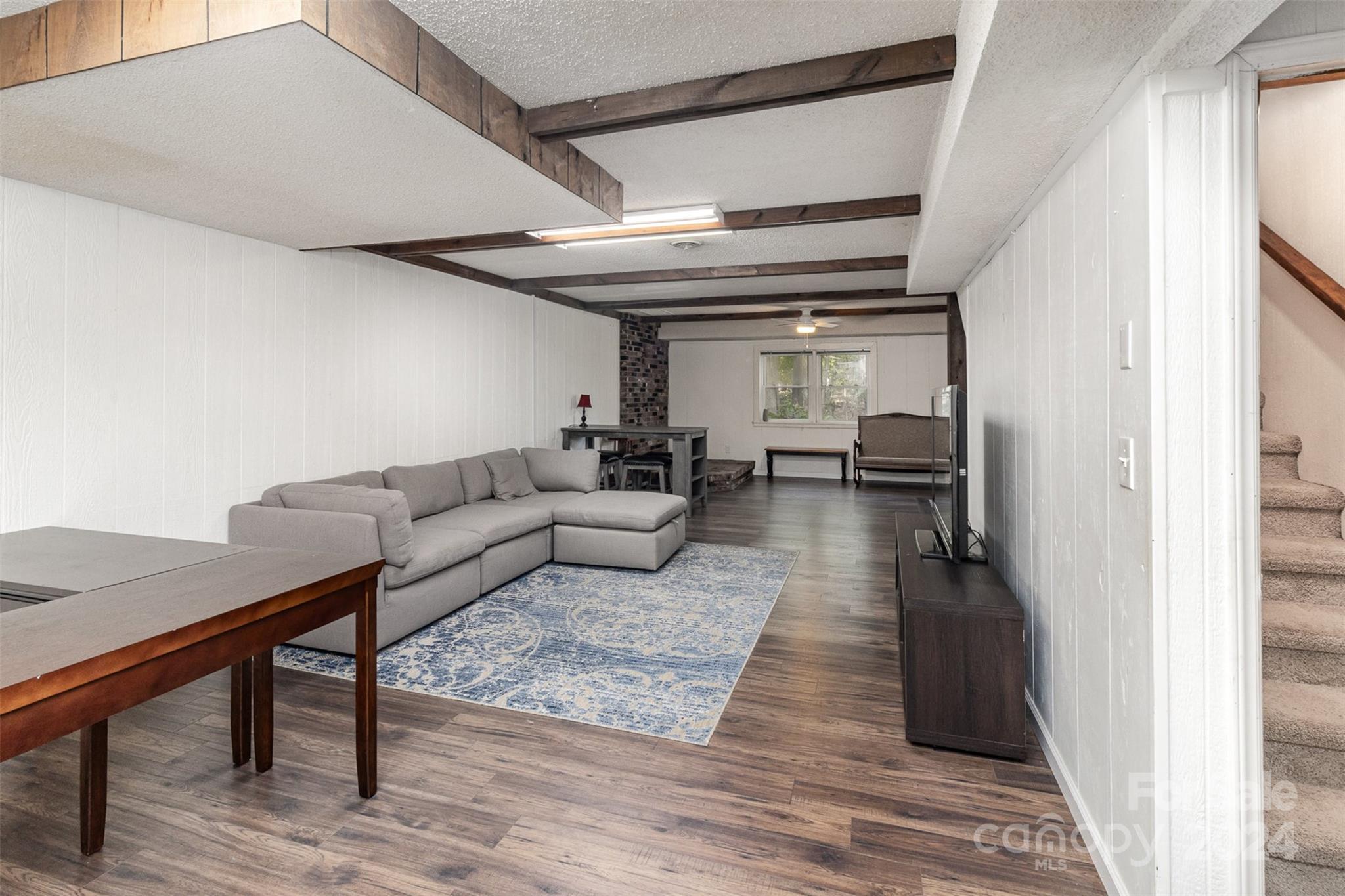 808 Dogwood Drive Lowell, NC 28098 - Photo 24 of 36 a living room with furniture and a wooden floor