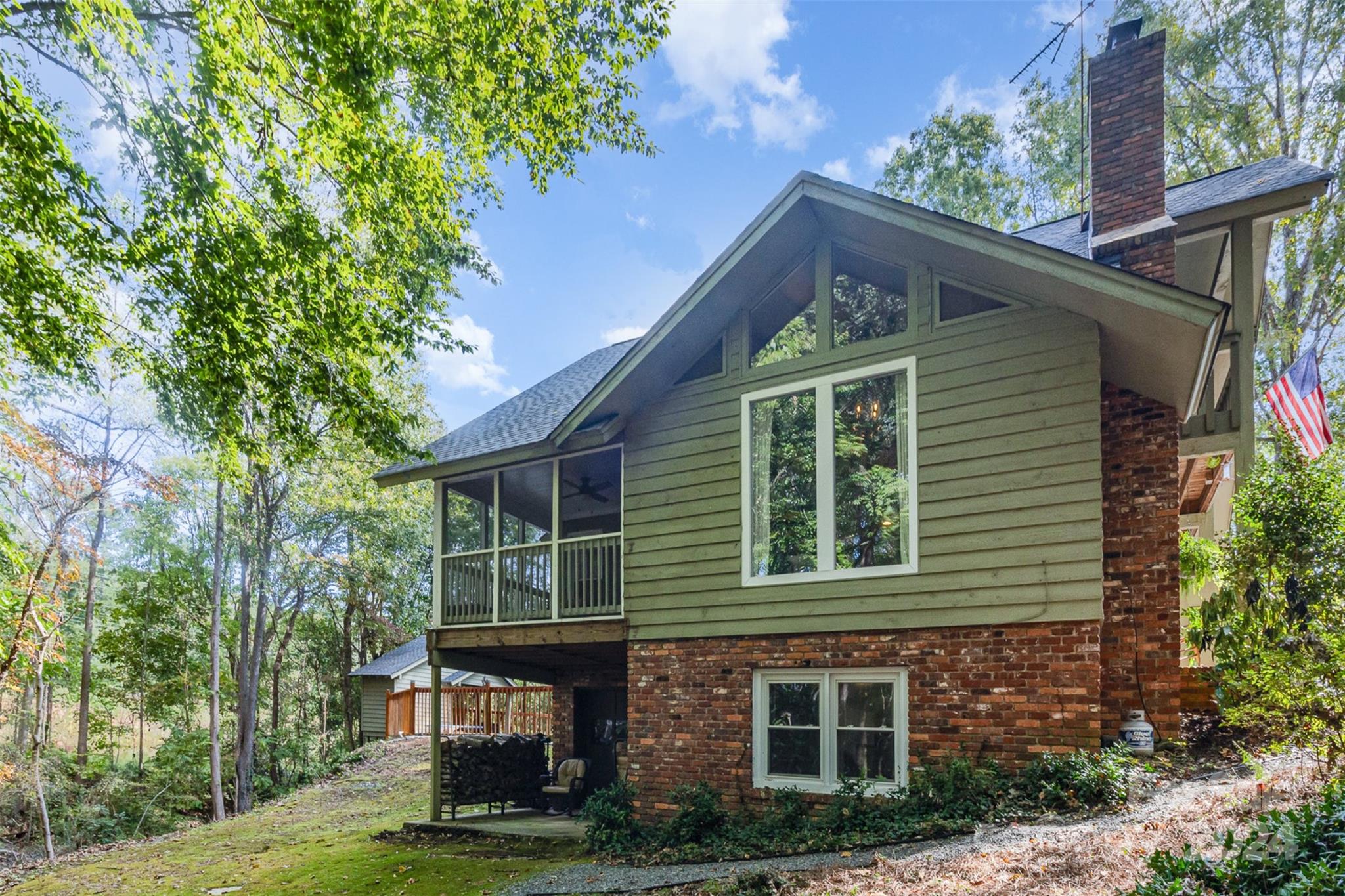 808 Dogwood Drive Lowell, NC 28098 - Photo 30 of 36 a front view of a house with a garden