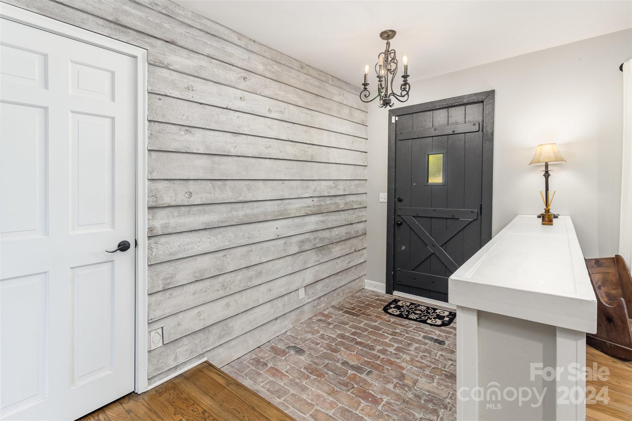 808 Dogwood Drive Lowell, NC 28098 - Photo 3 of 36 a view of a hallway to rooms