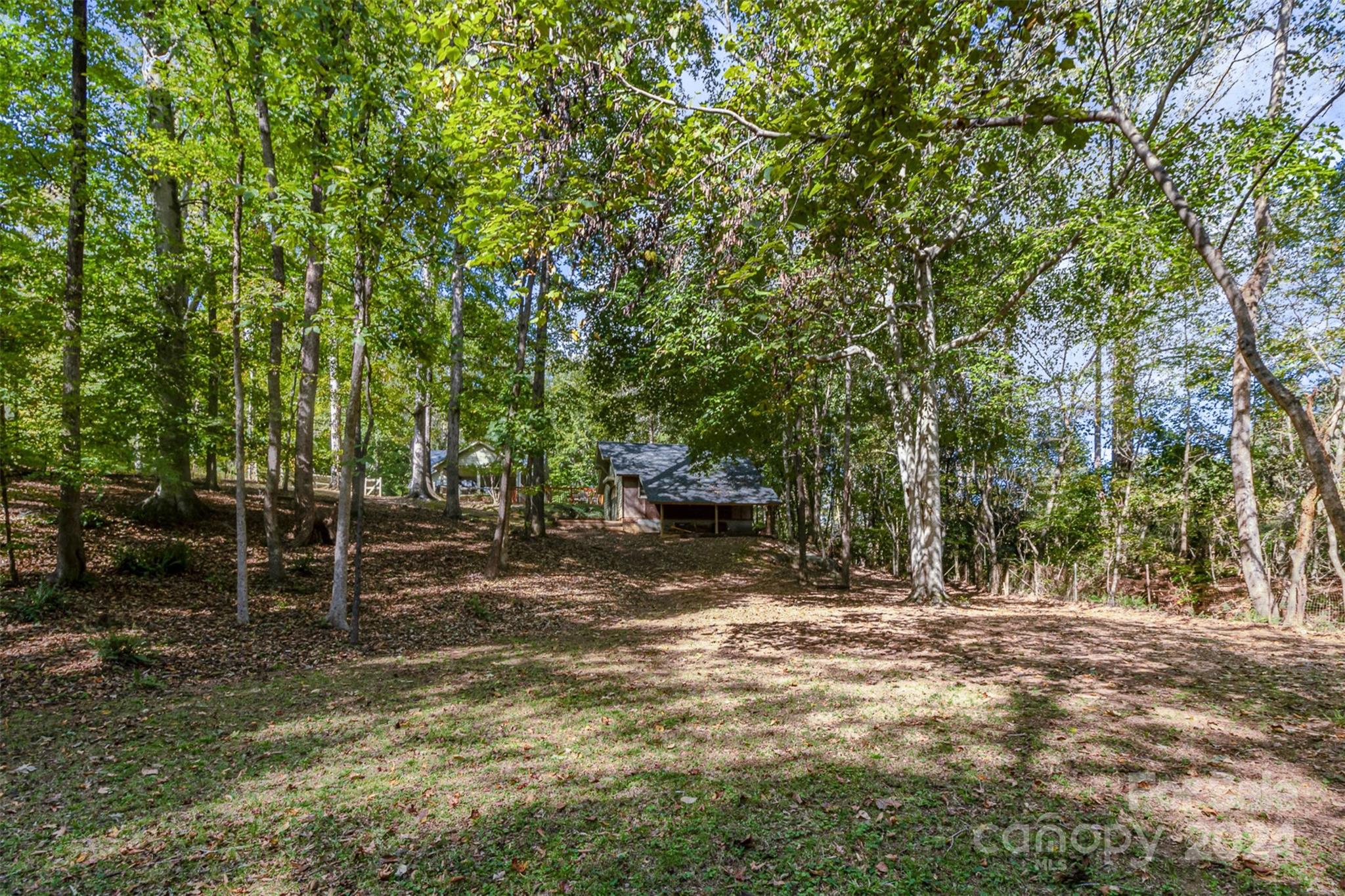 808 Dogwood Drive Lowell, NC 28098 - Photo 35 of 36 a view of a field with trees in the background