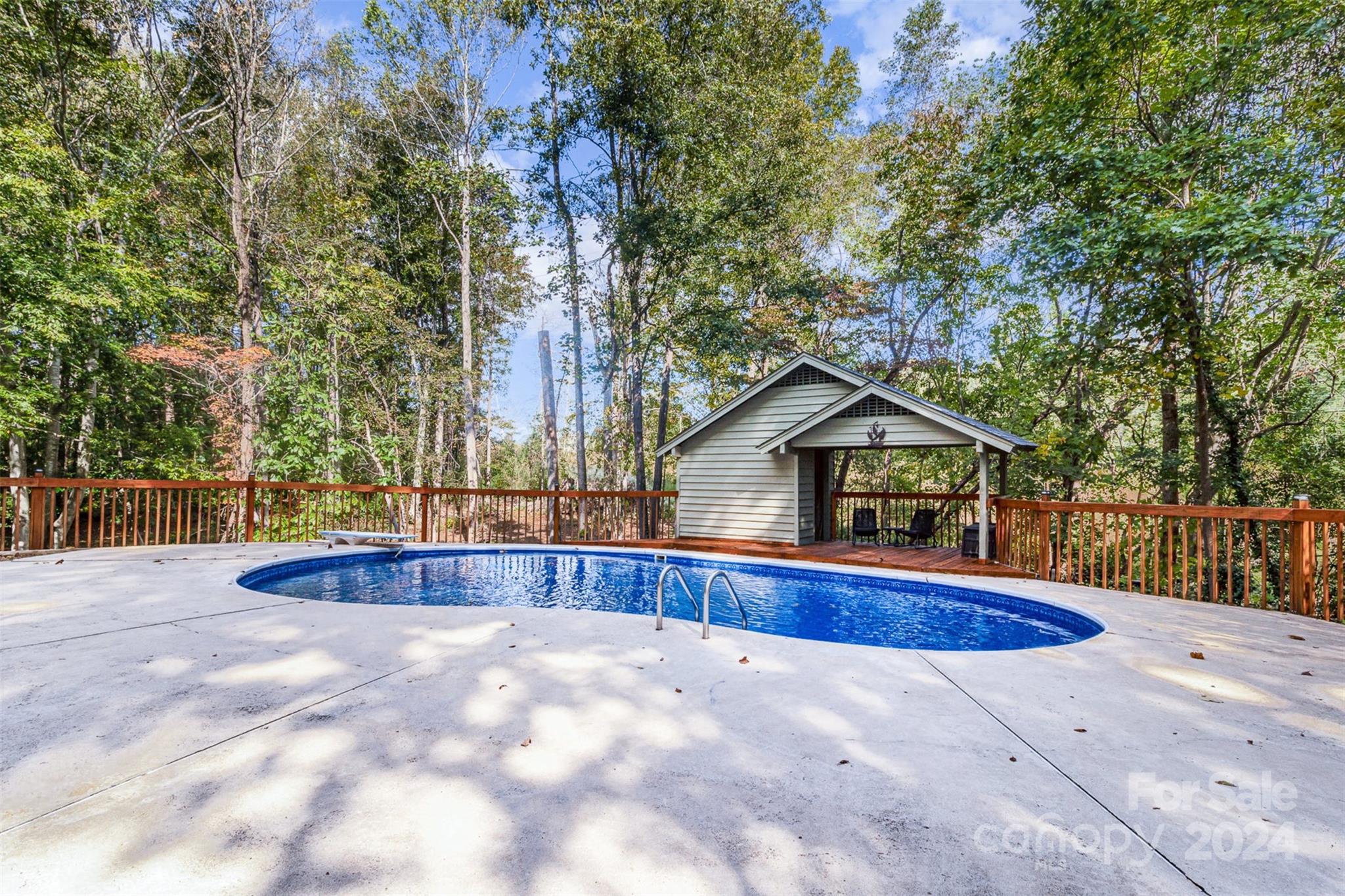 808 Dogwood Drive Lowell, NC 28098 - Photo 36 of 36 a view of pool and trees in the background