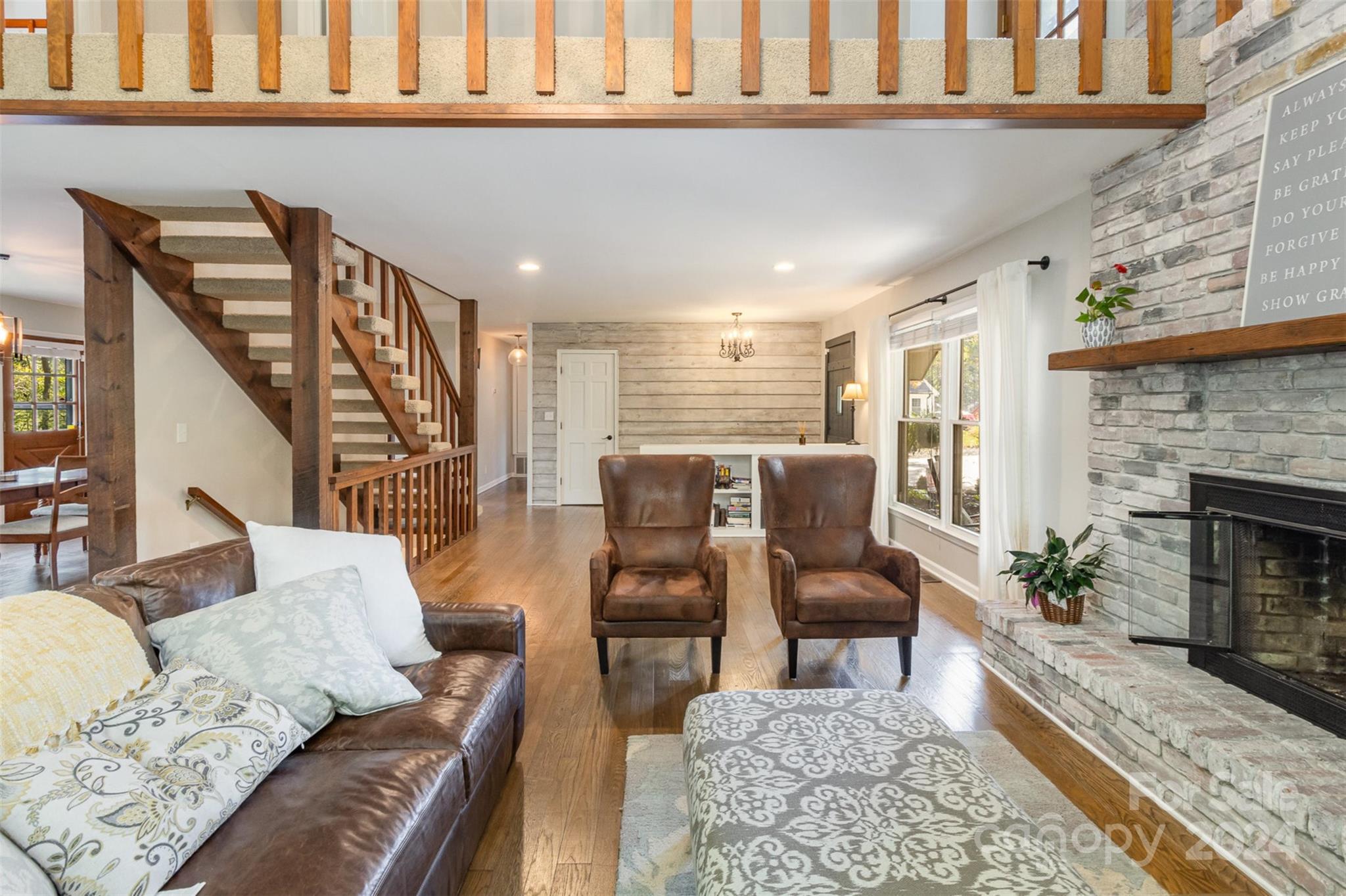 808 Dogwood Drive Lowell, NC 28098 - Photo 7 of 36 a living room with furniture and a fireplace