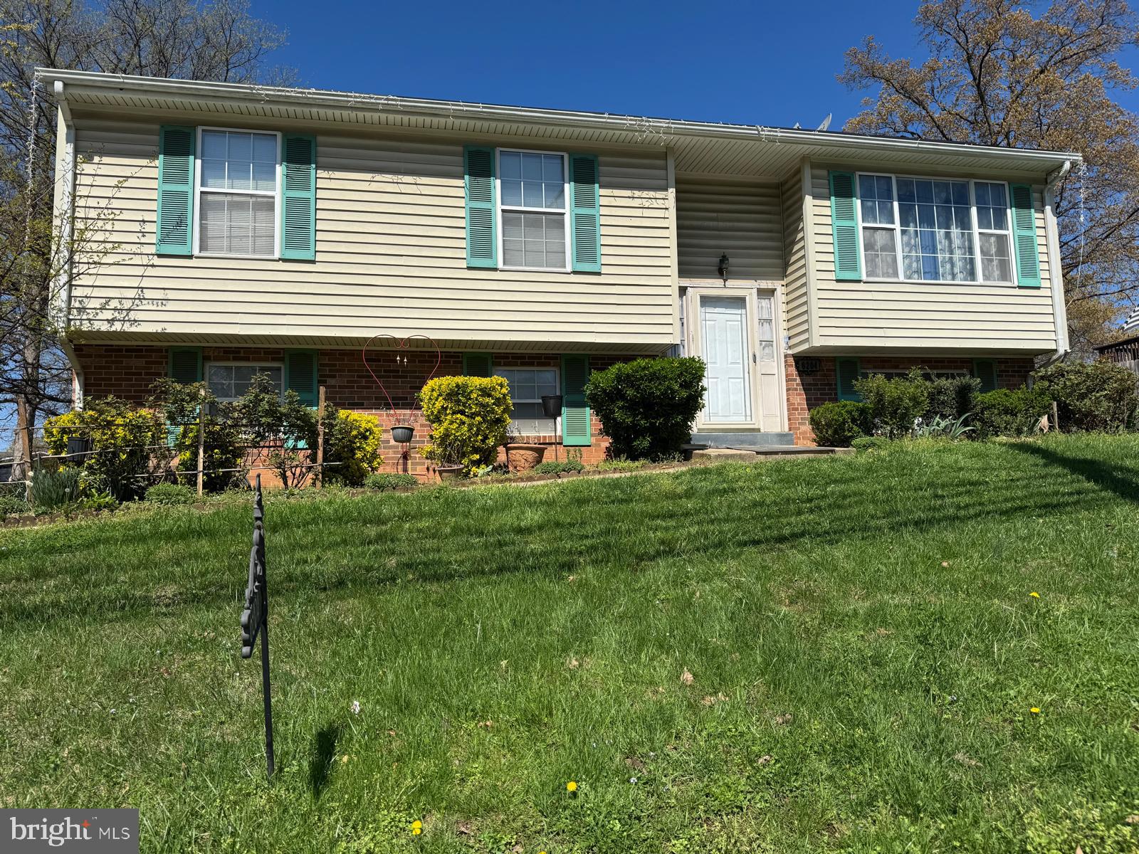 a front view of house with yard and outdoor seating