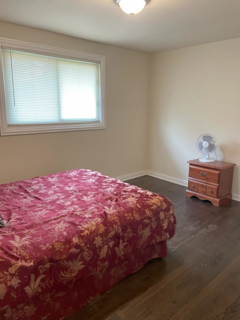 14647 Irving Avenue Dolton, IL 60419 - Photo 15 of 24 a bedroom with a bed and window