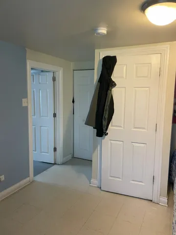 a bed room with a bed and a dresser