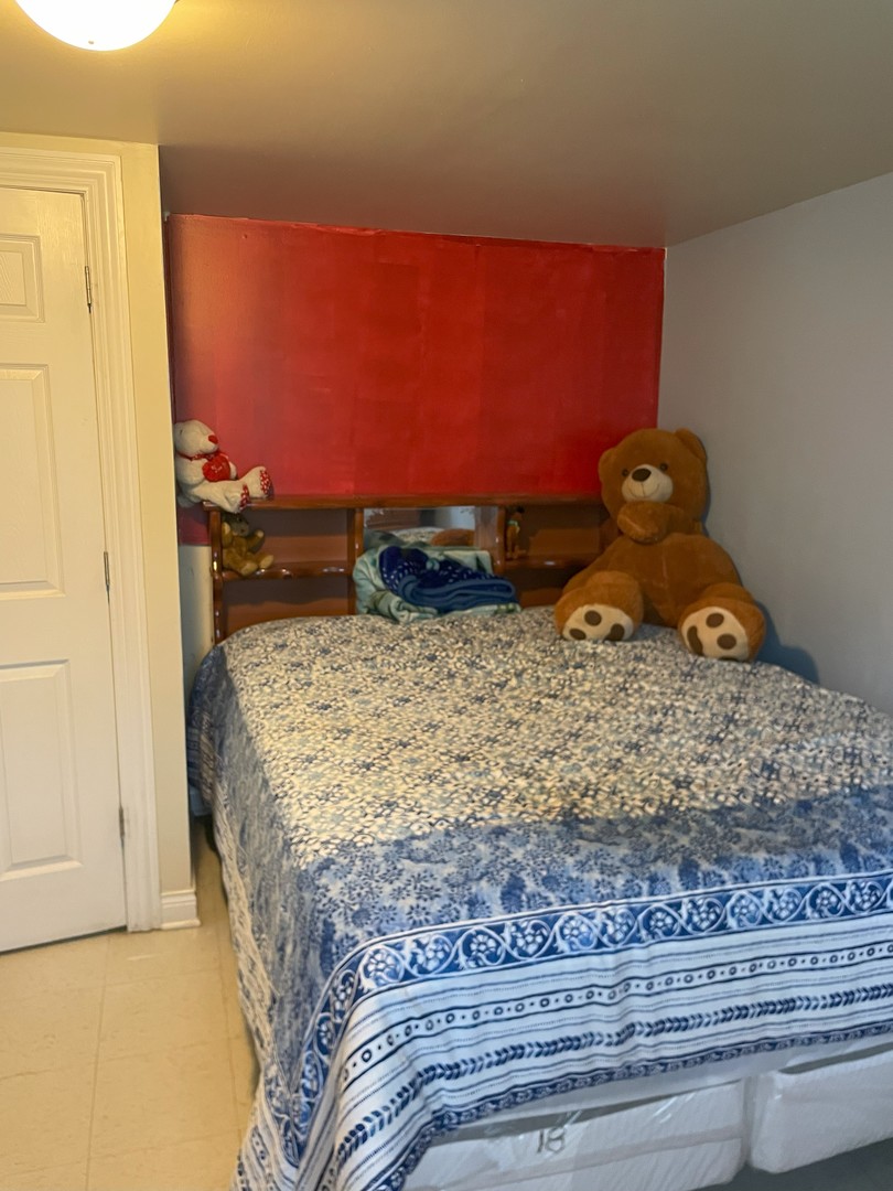 14647 Irving Avenue Dolton, IL 60419 - Photo 20 of 24 a bed room with a bed and a dresser