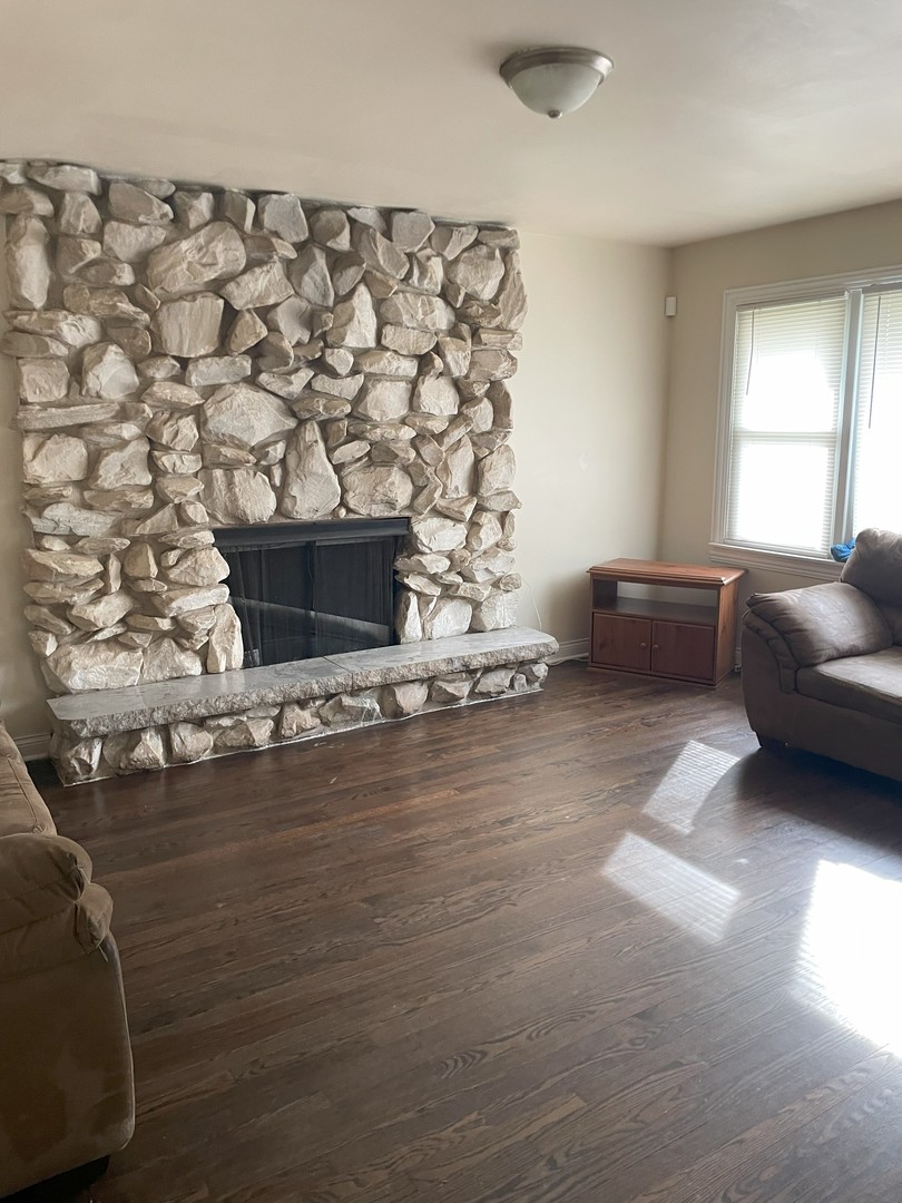 14647 Irving Avenue Dolton, IL 60419 - Photo 9 of 24 a living room with furniture and a fireplace