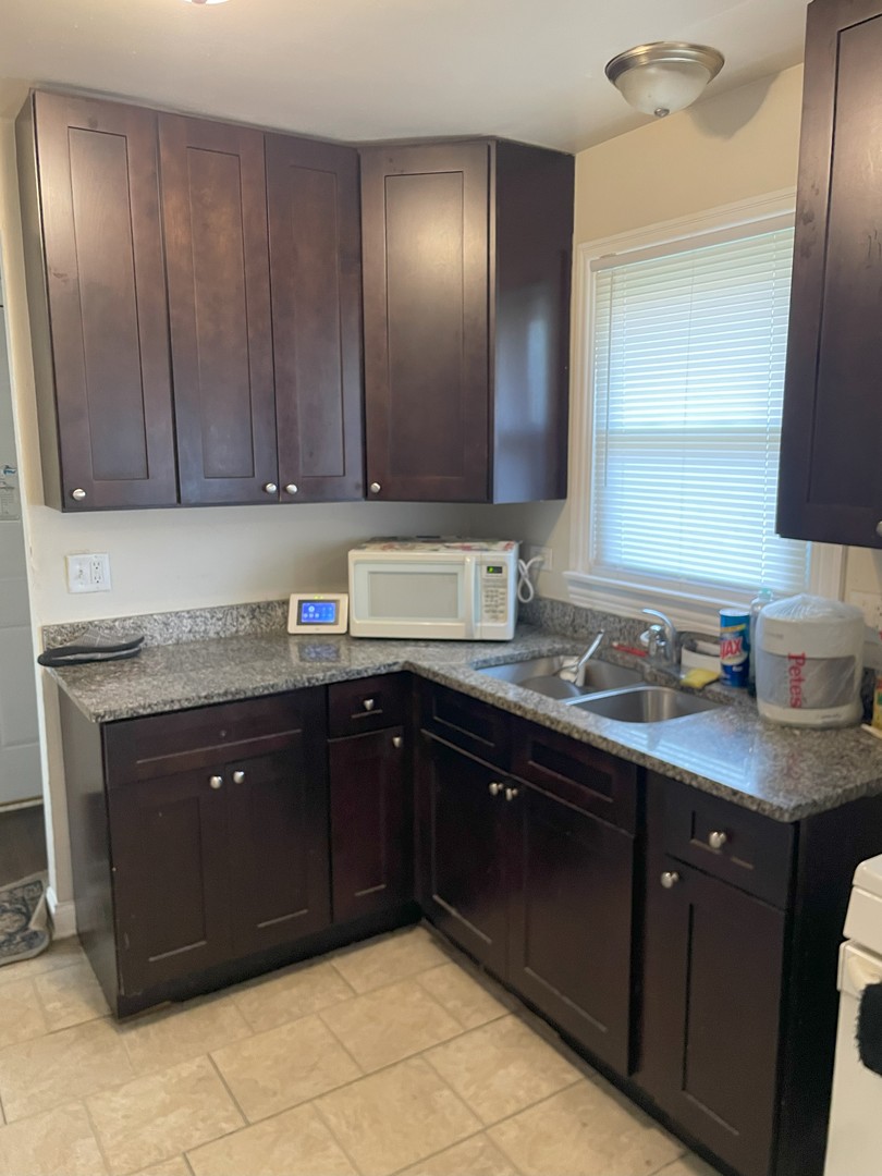 14647 Irving Avenue Dolton, IL 60419 - Photo 10 of 24 a kitchen with a sink and cabinets