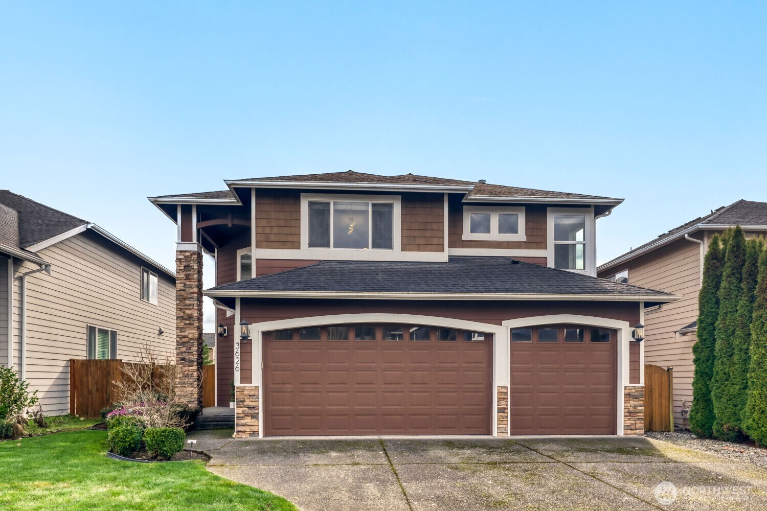 a front view of a house with garden