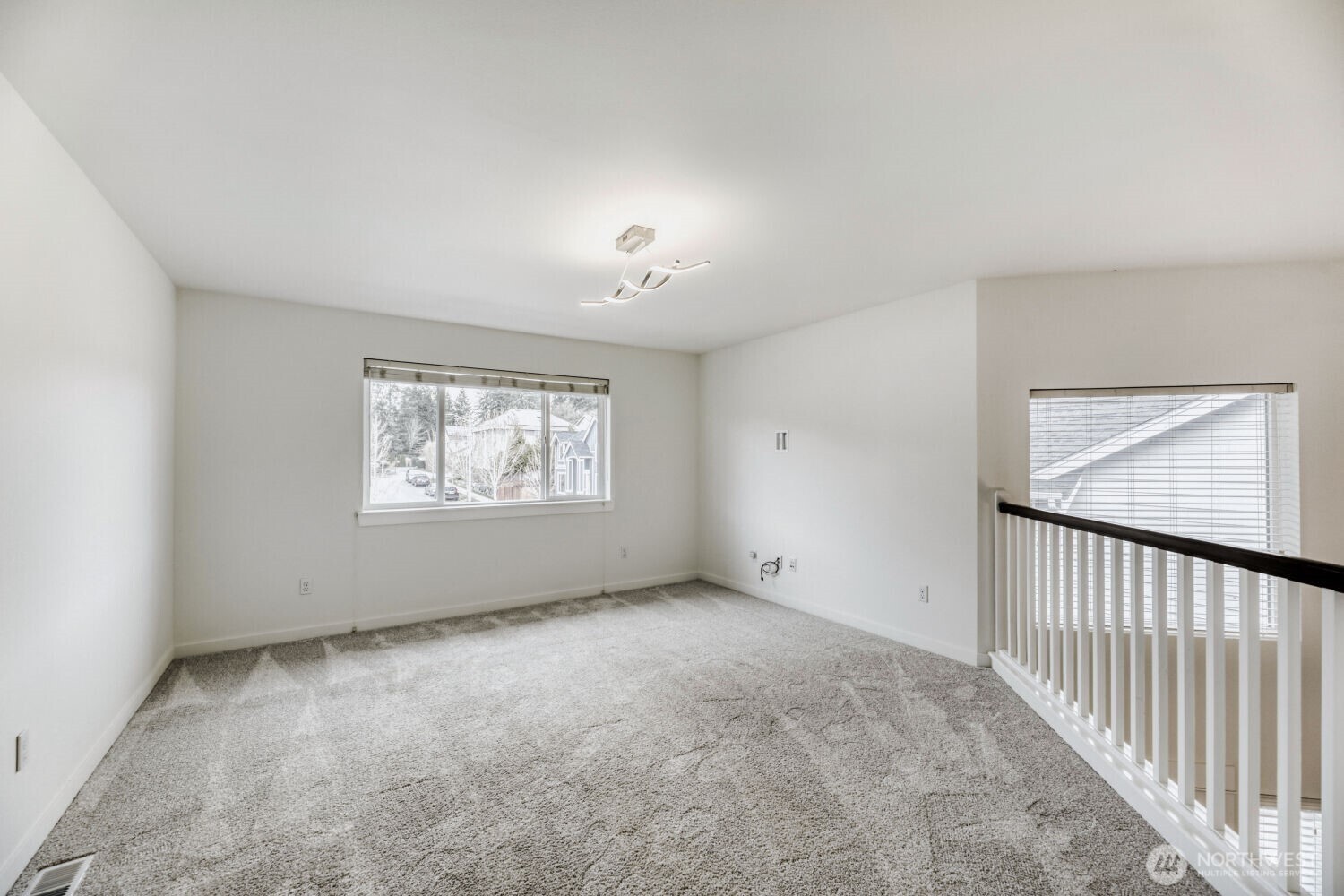3626 222nd Place Southeast Bothell, WA 98021 - Photo 11 of 27 an empty room with windows