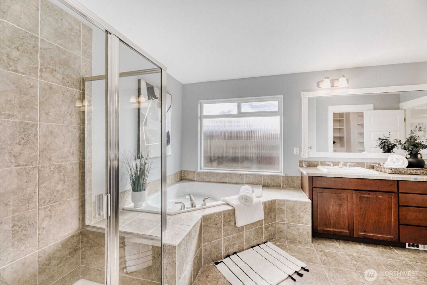 3626 222nd Place Southeast Bothell, WA 98021 - Photo 18 of 27 a bathroom with a tub sink and mirror