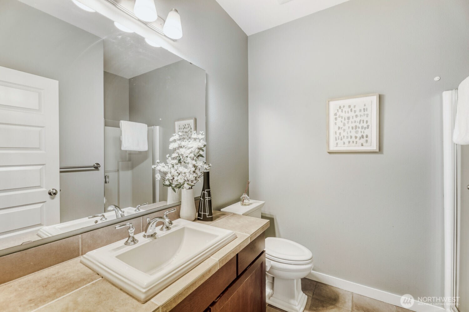 3626 222nd Place Southeast Bothell, WA 98021 - Photo 24 of 27 a bathroom with a sink a toilet and mirror