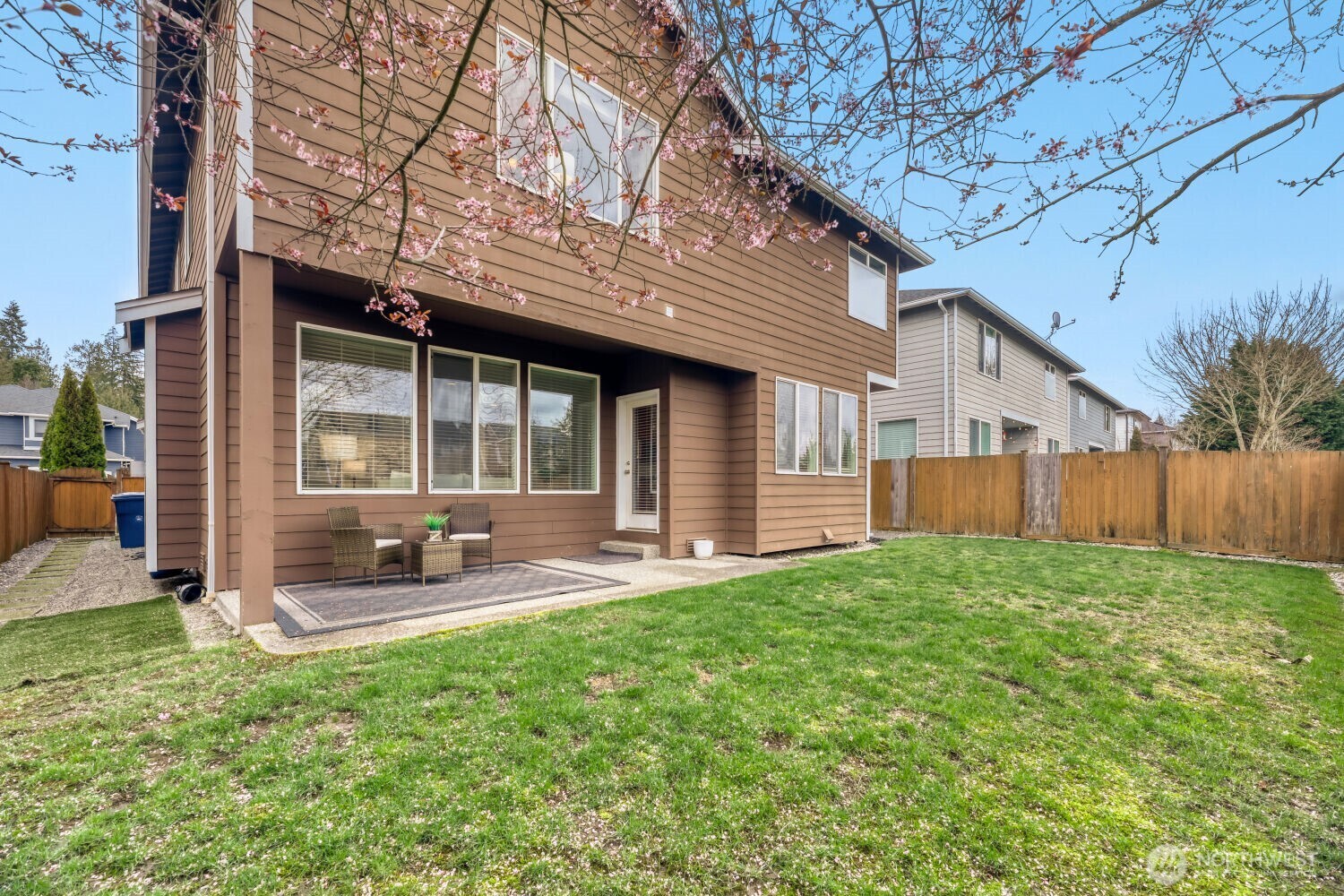 3626 222nd Place Southeast Bothell, WA 98021 - Photo 27 of 27 a front view of a house with a yard and chairs