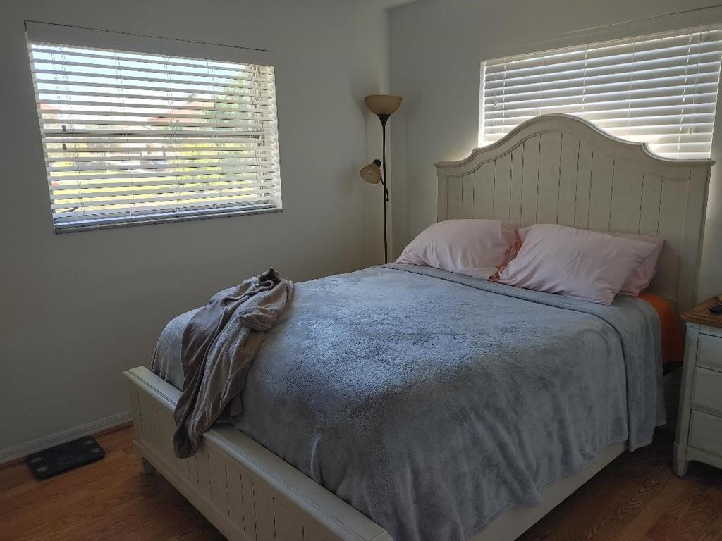 5004 Northwest 49th Road Tamarac, FL 33319 - Photo 6 of 16 a bedroom with a bed and a window