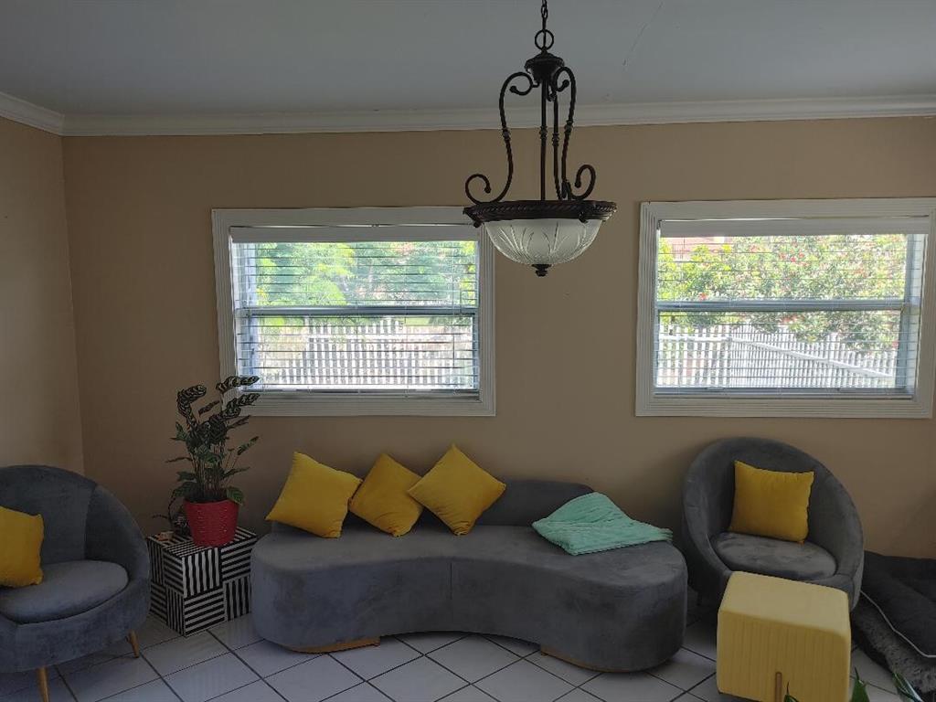 5004 Northwest 49th Road Tamarac, FL 33319 - Photo 8 of 16 a living room with furniture and a window