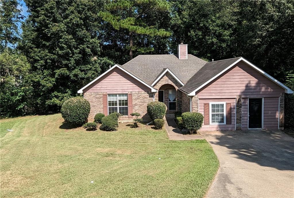 300 Nicole Terrace Stockbridge, GA 30281 - Photo 1 of 1 a view of a house with yard and plants