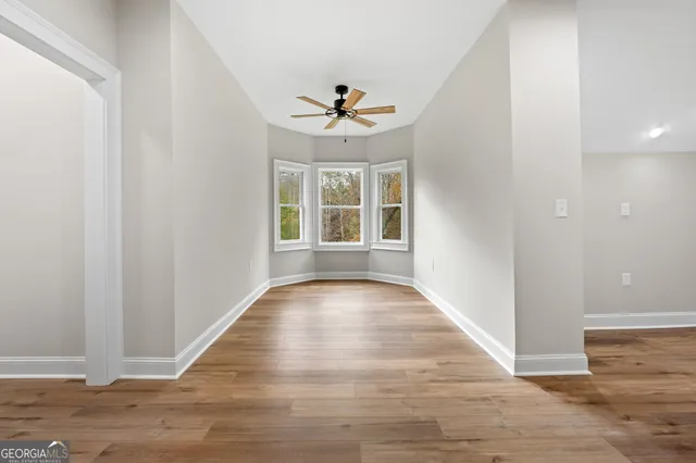 a view of wooden floor in an empty room