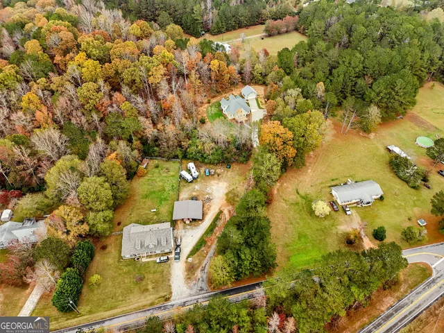 an aerial view of residential houses with outdoor space