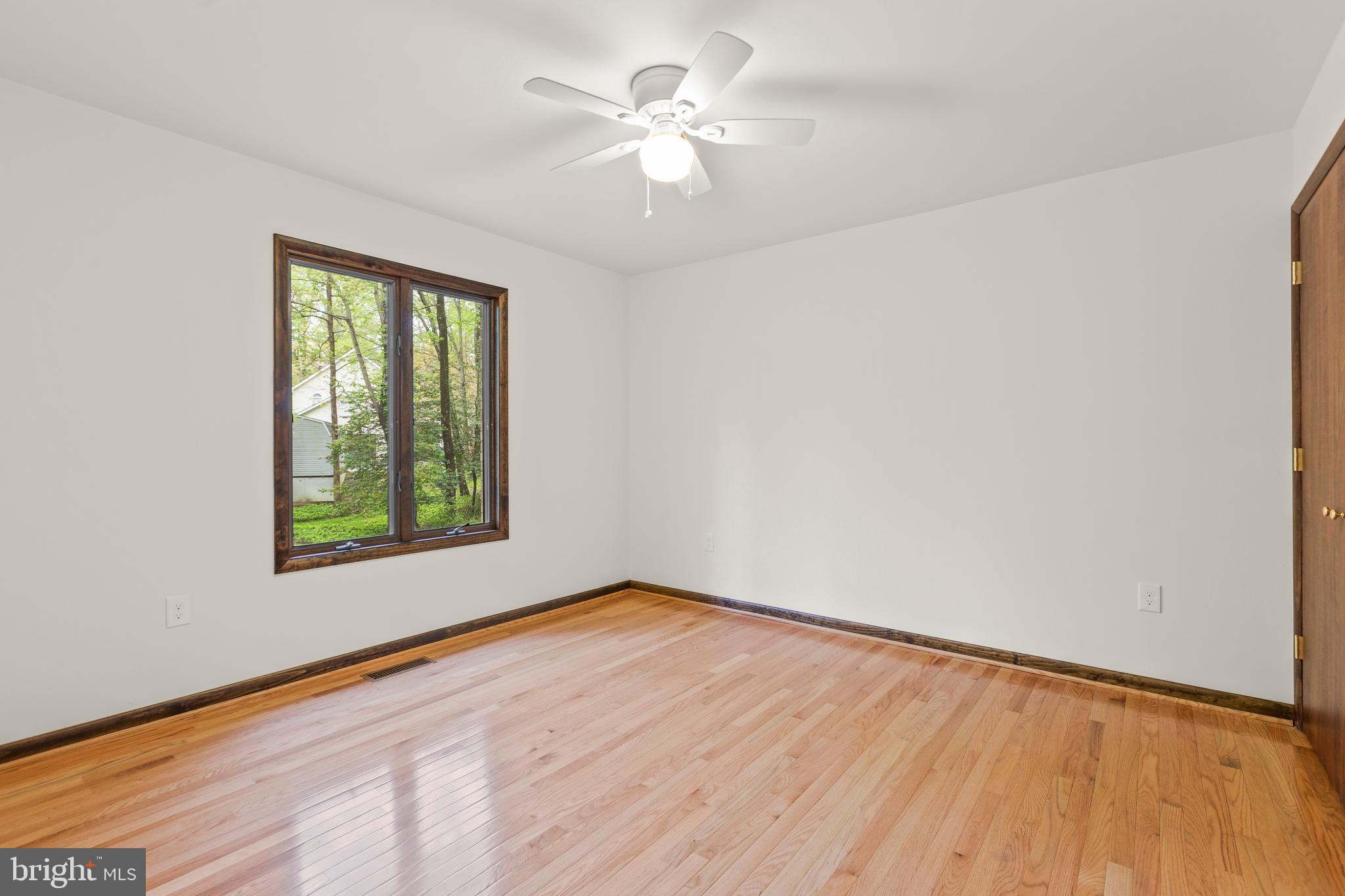 3200 Hickory Ridge Road Dunkirk, MD 20754 - Photo 25 of 44 wooden floor in an empty room with a window