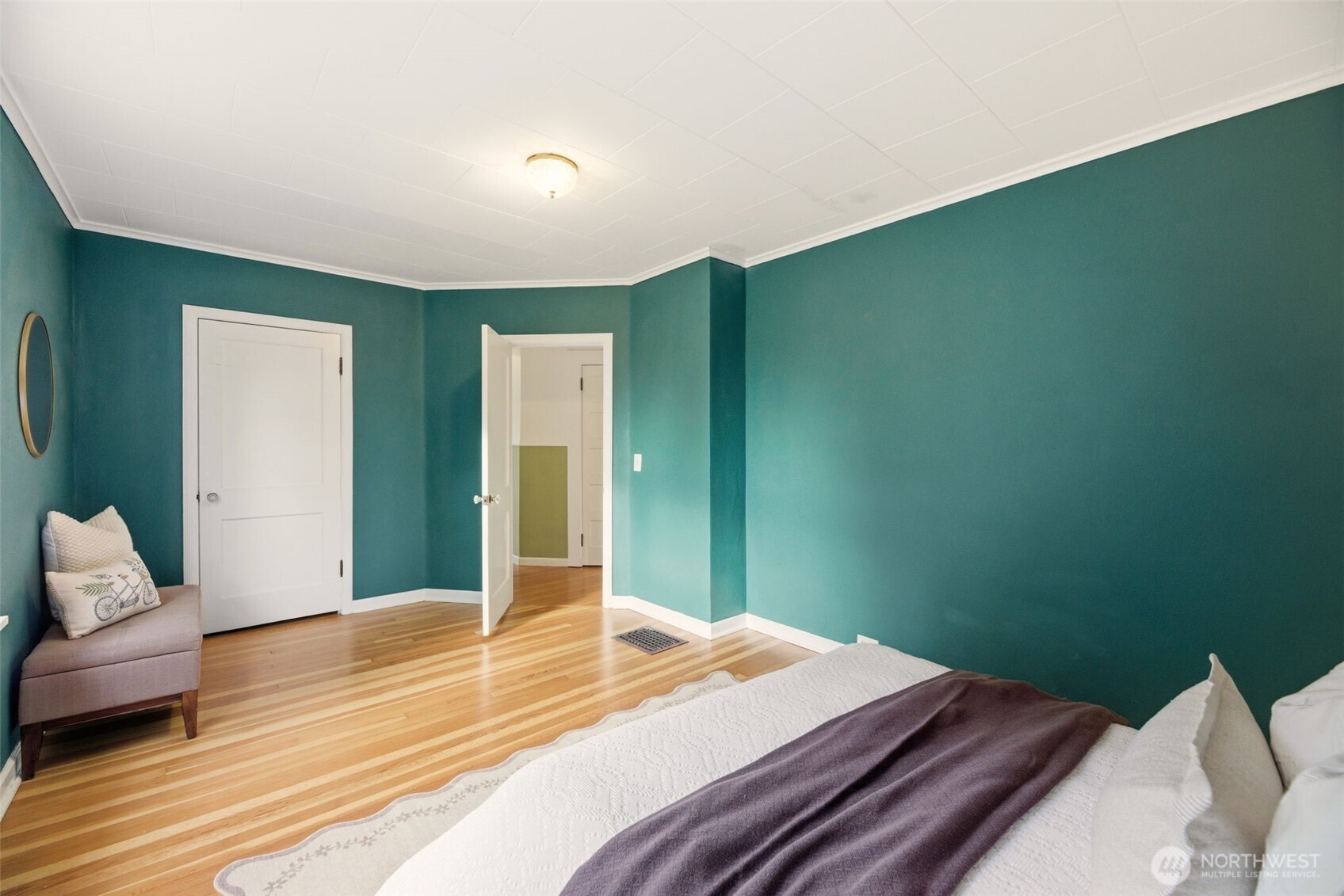 217 6th Street Snohomish, WA 98290 - Photo 19 of 40 a bedroom with a bed and wooden floor