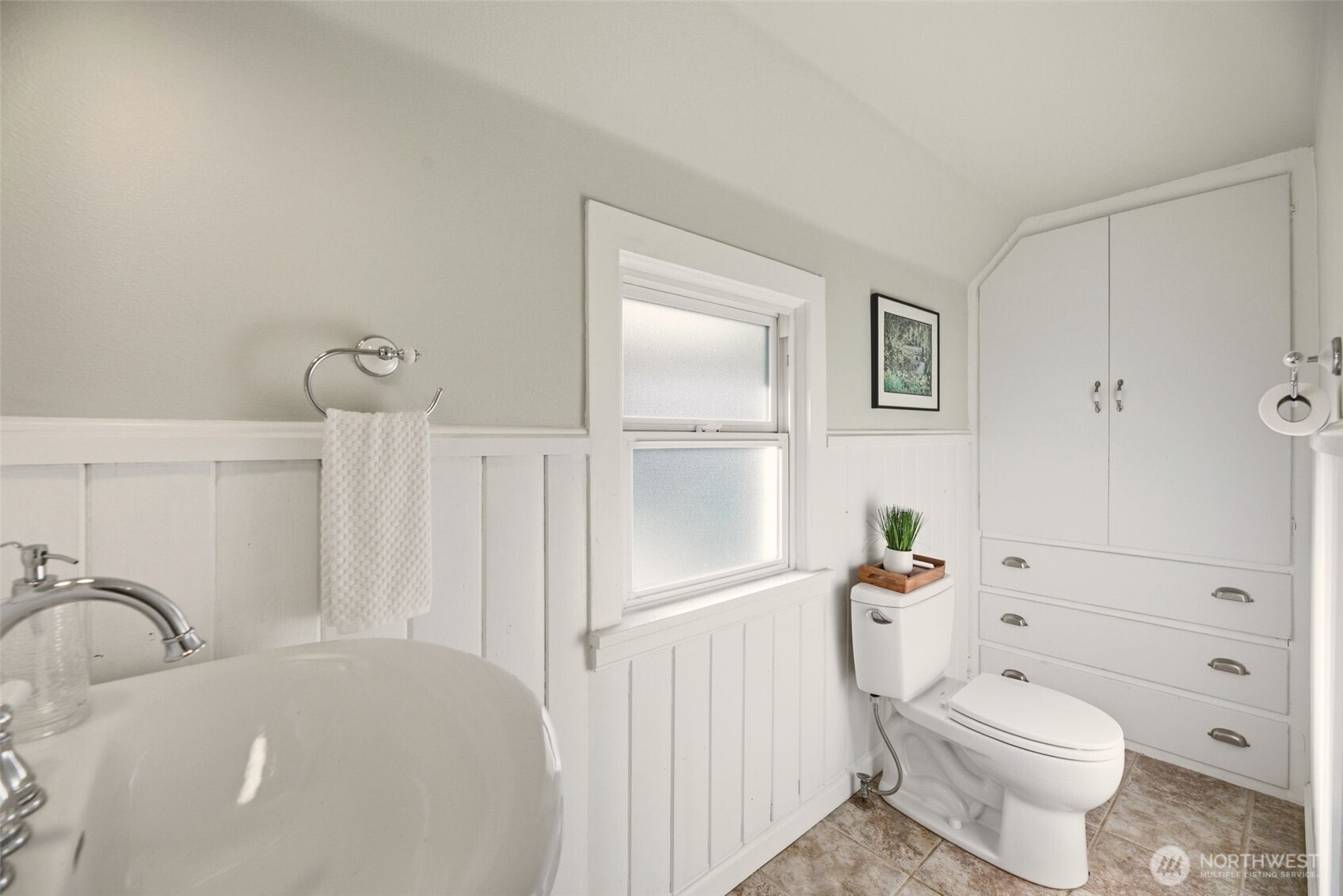 217 6th Street Snohomish, WA 98290 - Photo 20 of 40 a white toilet sitting next to a bathroom sink