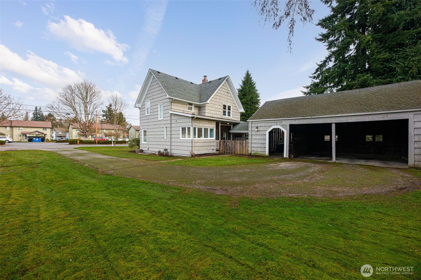 217 6th Street Snohomish, WA 98290 - Photo 30 of 40 a front view of a house with a garden and porch