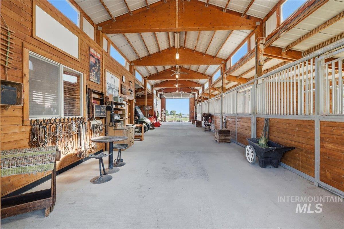 20337 Maggard Lane Caldwell, ID 83607 - Photo 32 of 50 Stalls to the left and storage, vet/grooming area and tack room are to the right.
