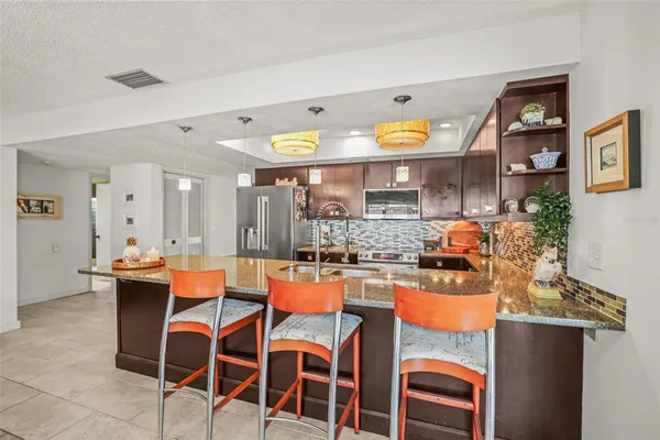a dining room with a table and chairs