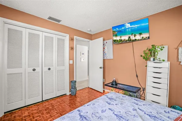 a bedroom with a bed and a dresser