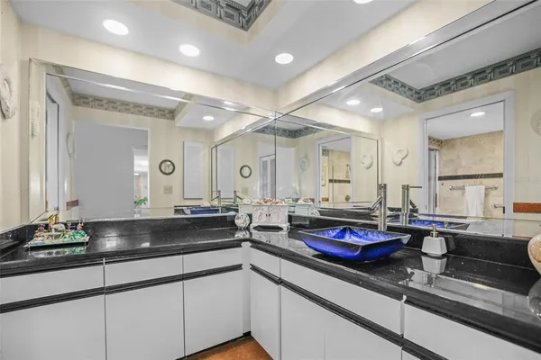 a large kitchen with lots of counter space and sink