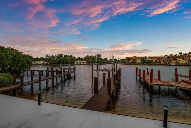 a view of a lake with a table and chairs