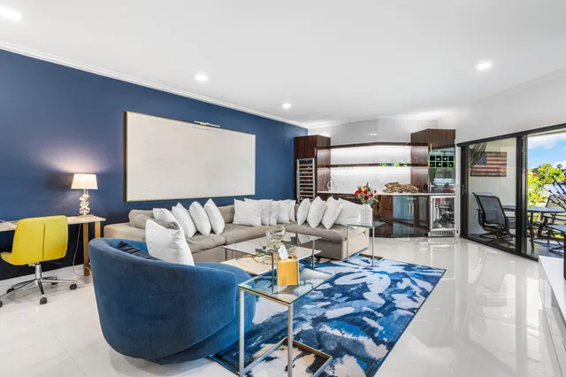 a bedroom with a large bed and a flat tv screen