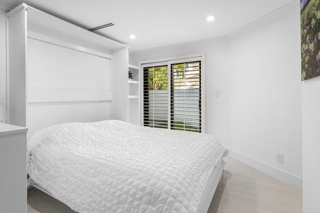 a bathroom with a tub a sink and a mirror