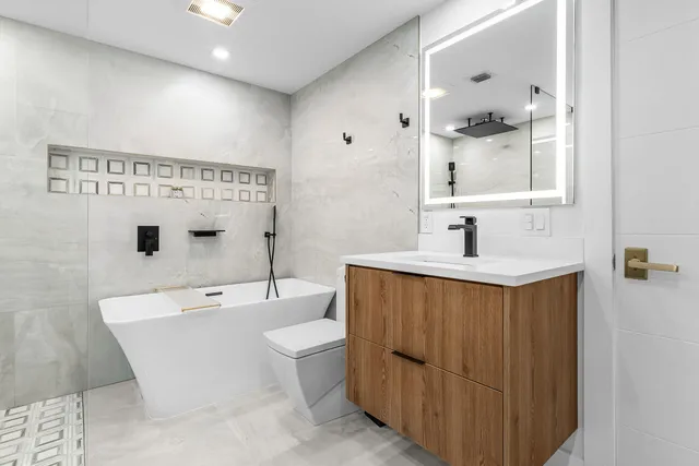 an aerial view of a house with a lake view