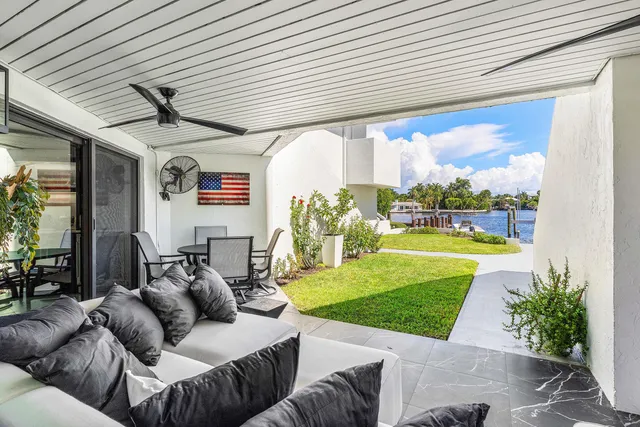 view of lake with boats and trees all around