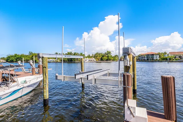 a living room with patio furniture and a potted plants