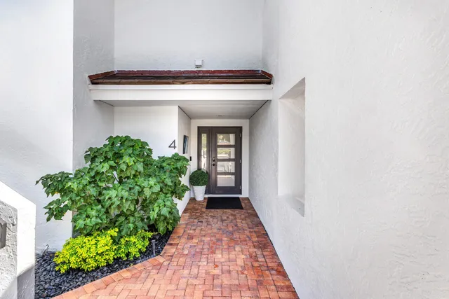 a kitchen with stainless steel appliances a sink stove and cabinets