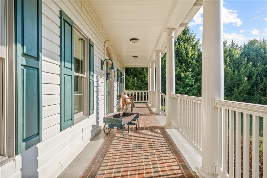 959 Bentleyville Road Charleroi, PA 15022 - Photo 4 of 48 44 ft Full length front porch with inlayed brick paver floor