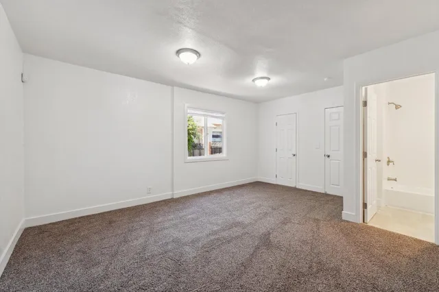 a white toilet sitting next to a bath tub